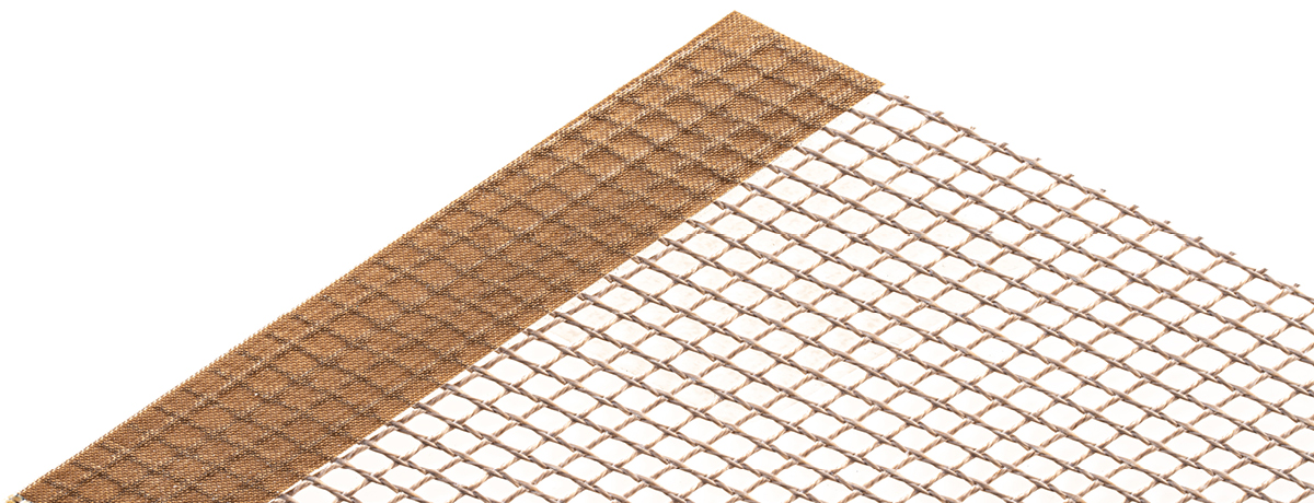 Heat sealed PTFE film edge reinforcement for conveyor belts